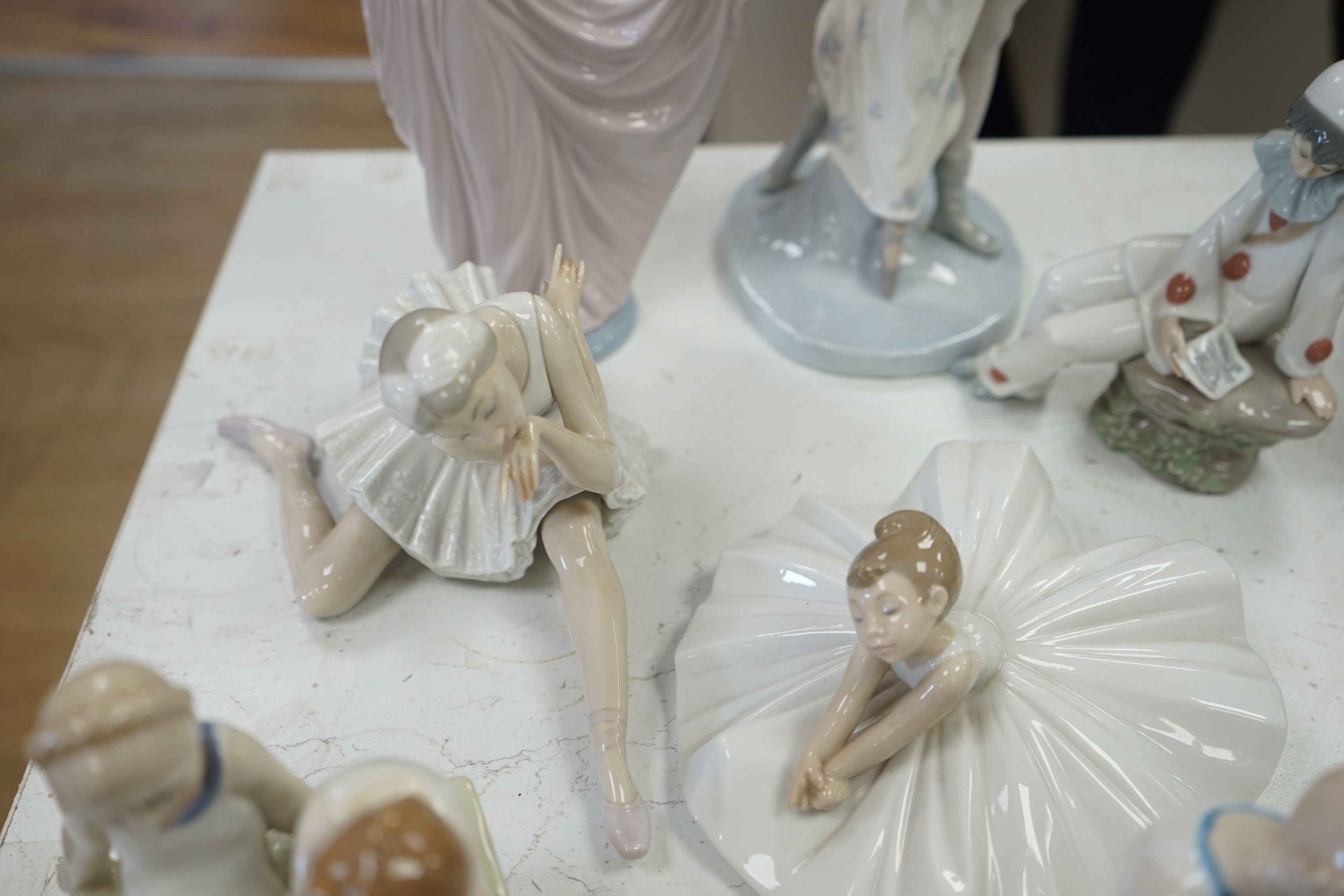 Seven various ceramic figures including Lladro, Nao and Doulton, tallest 33cm